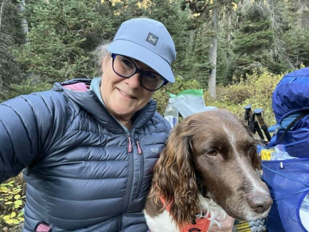 Anne outdoors with her dog
